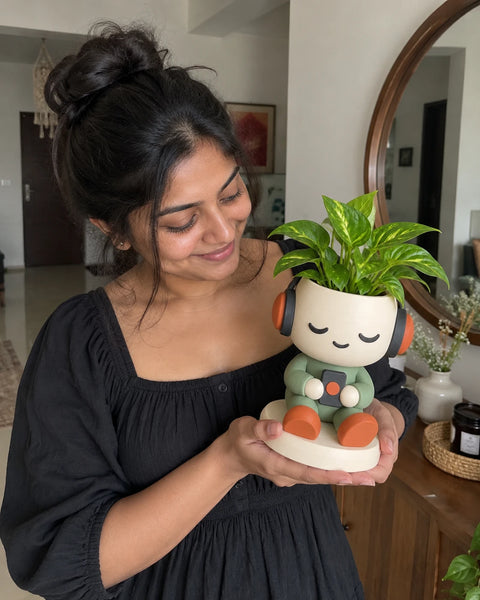 MiniKin Headphone Planter with a plant in a living room by a round mirror